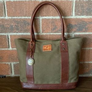 Will canvas and leather shoulder bag with unused travel pillow.